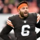 Baker Mayfield is a professional American football quarterback known for his strong arm, leadership skills, and competitive spirit.